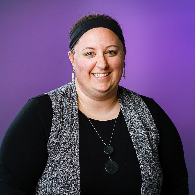 Kat Shaw - headshot on purple background